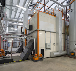 Modern boiler room on the wooden chips.
