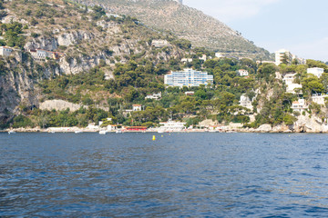 Fototapeta premium Luxury homes on the rocky Mediterranean coast of the French Riviera. Horizontal with copy space for text