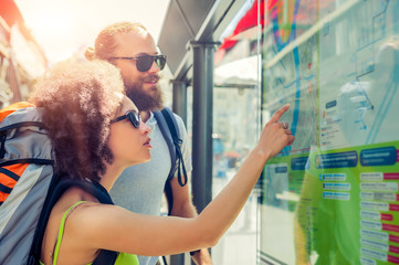 Tourists looking at city map