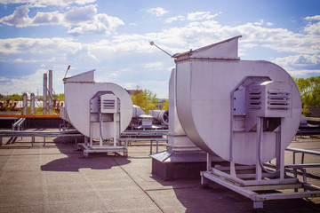 ventilation pipes on a roof. industrial ventilation system on the roof
