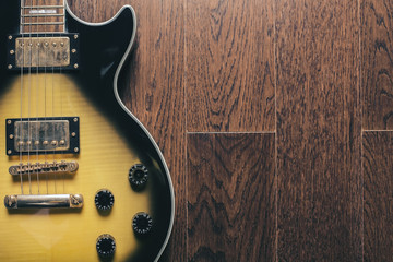 Electric guitar on brown surface