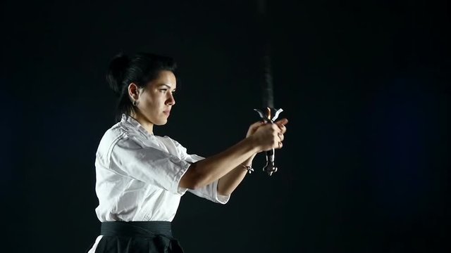 sportswoman twists the sword in her hand, slow motion