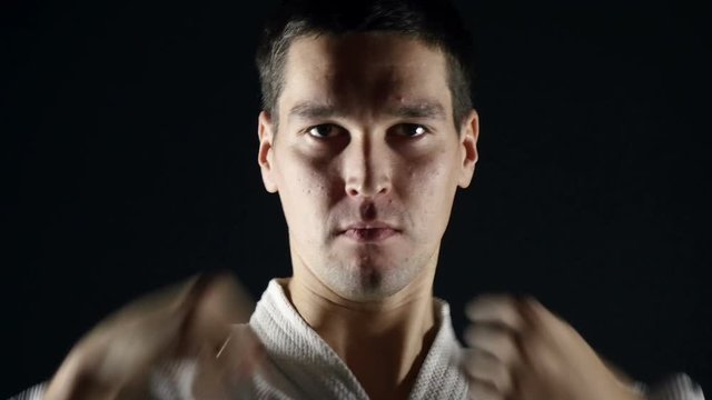 karateka in kimono practice  punches