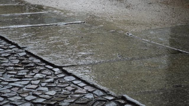 Rainy cobbled road with city noises
