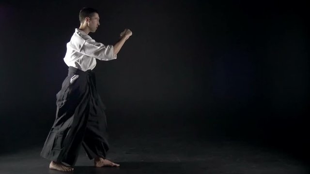 karateka trains the kicks, slow motion