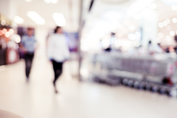 Blurred background, people shopping at department store with bok