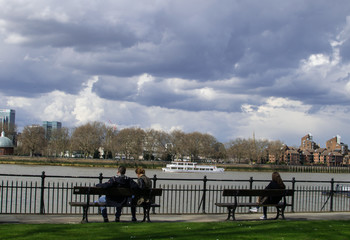 Embankment and People Looking at River.