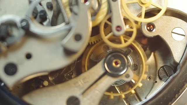 Metal cogwheels inside clockwork. Concept Eternity, Teamwork , Idea Technology. Macro. Tick-Tick Sound 