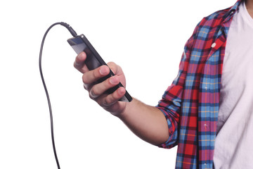 Young man listening to music with smartphone.