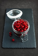 Red currants in a glass jar