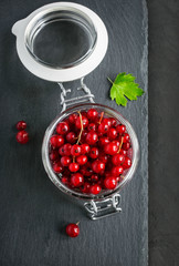 Red currants in a glass jar