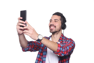 Young man taking a selfie with his smartphone.