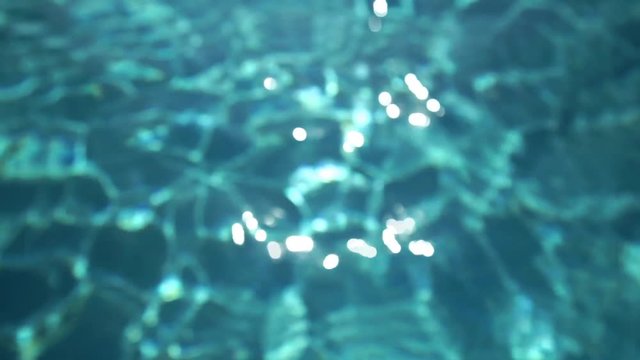 Pool water reflection in blue tone. Slow motion.