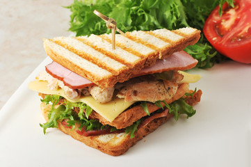sandwiches with lettuce, ham, cheese, chicken breast