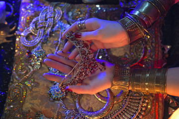 Golden Oriental Jewelry and Accessories: Female Hands with India
