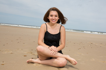 Fototapeta na wymiar Picture of a yoga beach woman doing a pose