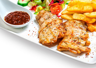 steak with fries and vegetables