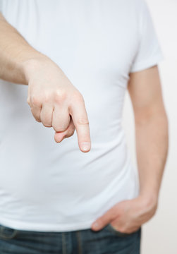 Male hand indicating down