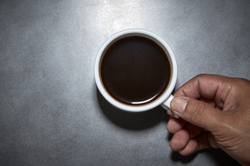 Holding Hot Black Coffee