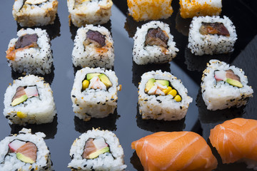 Sushi set isolated on black background