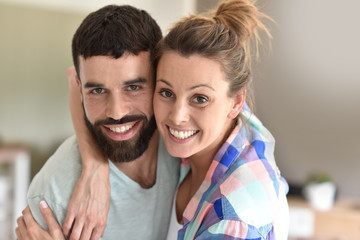 Fototapeta premium Cheerful hipster couple embracing each other