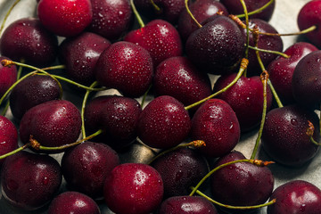 Cherries in a bowl with water drops 