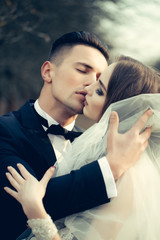 Kissing wedding couple