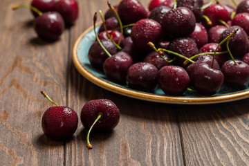 Cherries in a bowl with water drops 