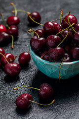 Cherries in a bowl with water drops 