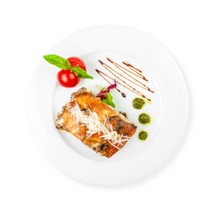 Portion of tasty lasagna, isolated on white