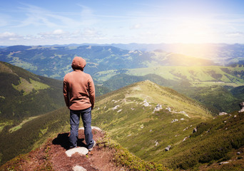 Man standing on the top of the mountain