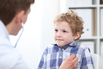 Doctor examining a child patient by stethoscope.  Health care o