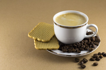 A mug of hot coffee with cookies