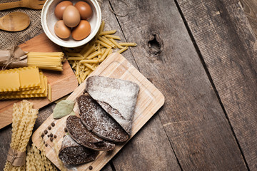 Pasta spaghetti with egg on old wooden background