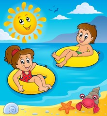 Obraz na płótnie Canvas Children in swim rings image 2