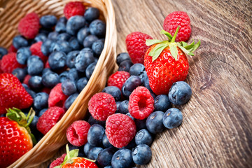 Berries on wooden background