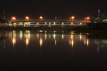 Fototapeta na wymiar Namphong river bridge at night in khonkaen,thailand.