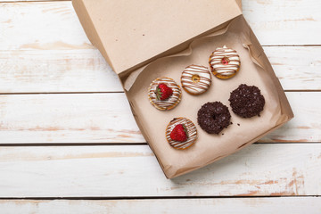 Colorful donuts in box