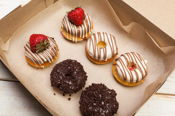 Colorful donuts in box