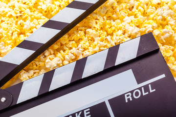 Movie clapper board and pop corn
