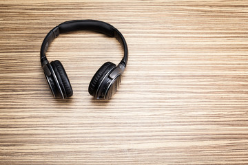 headphones on wooden background