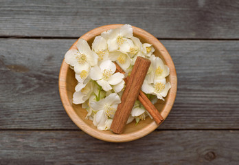 Jasmine and cinnamon on wooden background