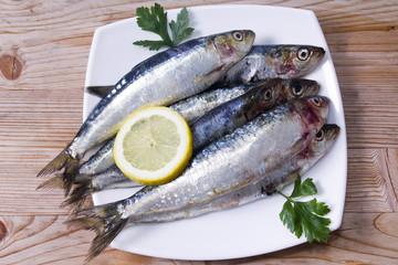 fish,  dish of sardines on wooden background