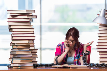 Young woman student preparing for college exams