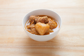 Chicken Mussaman Curry on wood table,  Thai food