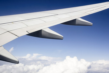 airplane wing above the city