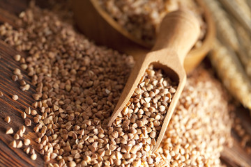 Buckwheat and wooden scoop