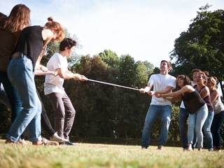 large group of friends together in a park having fun