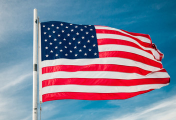 American flag against bright blue sky