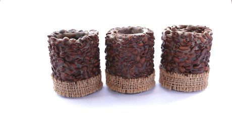 candles  with coffee beans on white